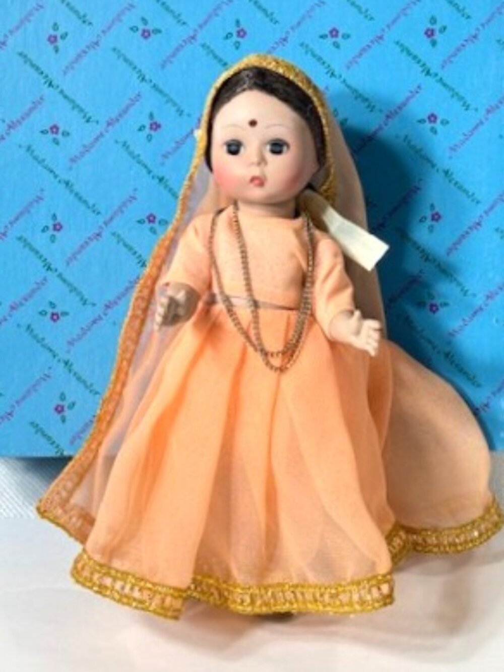 Madame Alexander restrung 8" India peach doll.